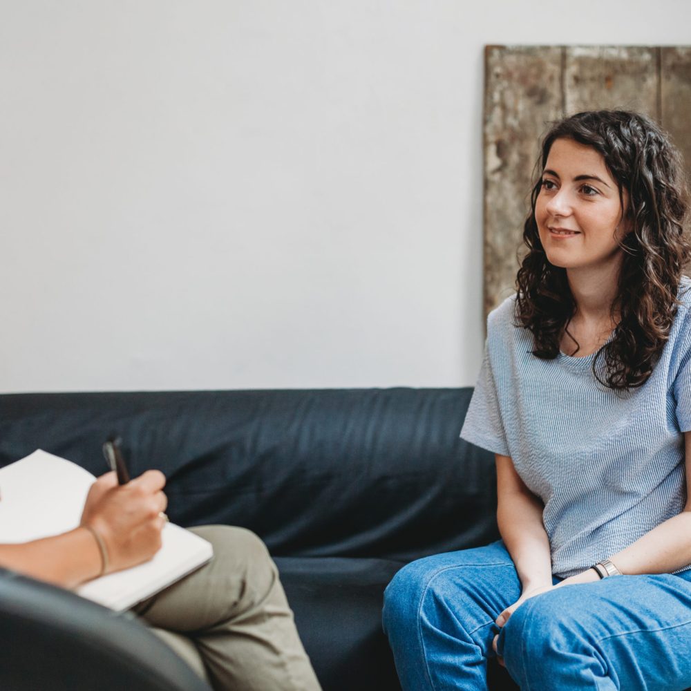 Psychotherapy session, woman talking to his psychologist in the studio